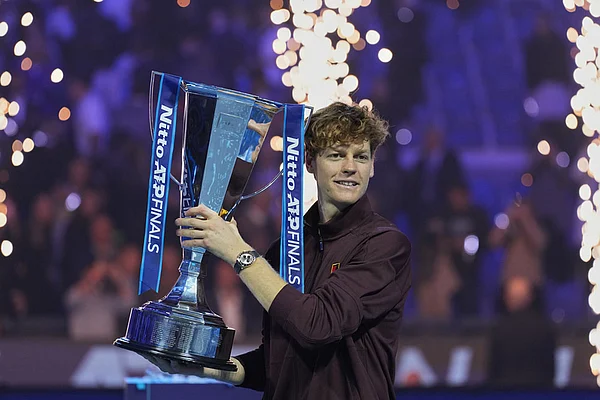 | Photo: AP/Antonio Calanni : Italy's Jannik Sinner holds the trophy after winning the final tennis match of the ATP World Tour Finals against Spain's Carlos Alcaraz in Turin, Italy.