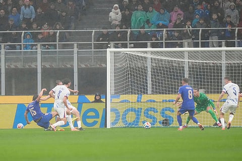 Italy's Pio Esposito, left, scores the opening goal during the 2026 World Cup Group I qualifier soccer match between Italy and Norway in Milan, Italy.