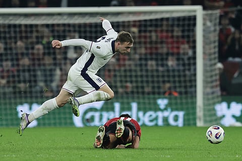 England's Jarrod Bowen, left, goes for the ball as Albania's Myrto Uzuni falls during the World Cup 2026 group K qualifying soccer match between Albania and England, in Tirana, Albania.