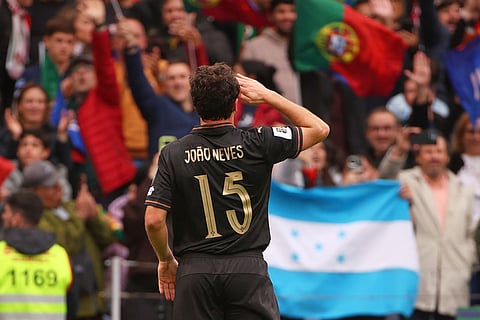 Portugal's Joao Neves celebrates after scoring his side's third goal during a World Cup 2026 group F qualifying soccer match between Portugal and Armenia in Porto, Portugal.