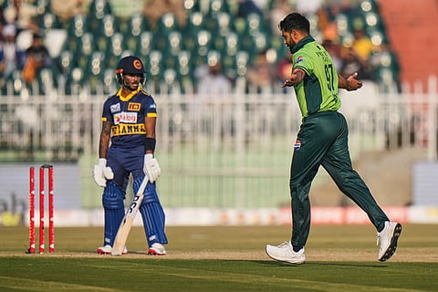 Pakistan's Haris Rauf, right, celebrates after the dismissal of Sri Lanka's Pathum Nissanka during the third one day international cricket match between Pakistan and Sri Lanka, in Rawalpindi, Pakistan.