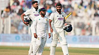 AP : India's Jasprit Bumrah, right, and batting partner Mohammed Siraj, left, leave the field with South Africa's captain Temba Bavuma at the end of the first Test in Kolkata.