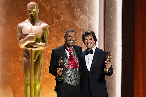 Wynn Thomas, left, and Tom Cruise, winners of Academy honorary awards pose onstage during the 16th Governors Awards at The Ray Dolby Ballroom in Los Angeles. 