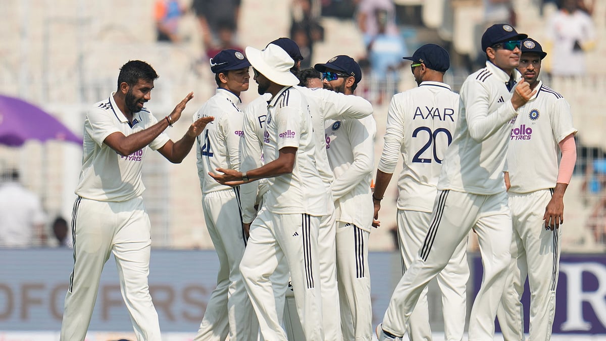 India Vs South Africa, 1st Test Match Day 1: India's Jasprit Bumrah, left, celebrates with teammates after the dismissal of South Africa's Aiden Markram on the first day of the first cricket test match between India and South Africa in Kolkata, India, Friday, Nov. 14, 2025. -  (AP Photo/Aijaz Rahi)
