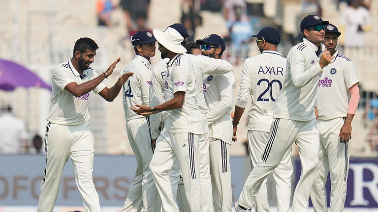 India Vs South Africa, 1st Test Match Day 1: India's Jasprit Bumrah, left, celebrates with teammates after the dismissal of South Africa's Aiden Markram on the first day of the first cricket test match between India and South Africa in Kolkata, India, Friday, Nov. 14, 2025. - (AP Photo/Aijaz Rahi)