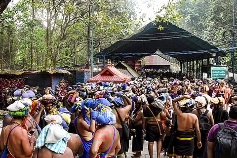 Devotees carry ‘Irumudi’ during the 'Vrischikam' after the Sabarimala temple opened for 'Mandala-Makaravilakku' pilgrimage season, in Pathanamthitta.