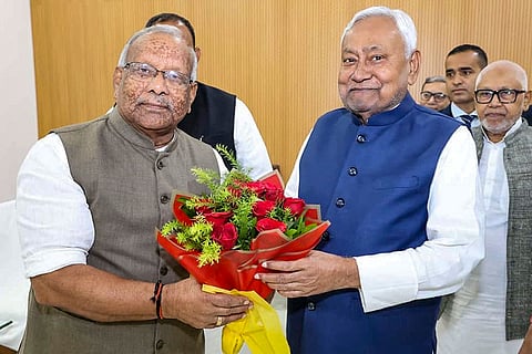 Bihar Chief Minister Nitish Kumar with former deputy chief minister Tarkishore Prasad during a meeting, in Patna.