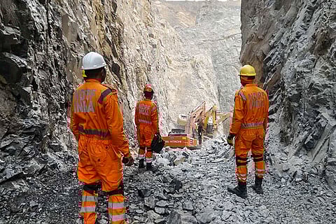 NDRF personnel during a rescue operation after a portion of a stone quarry collapsed, in Sonbhadra, Uttar Pradesh. At least six workers were killed in the incident.