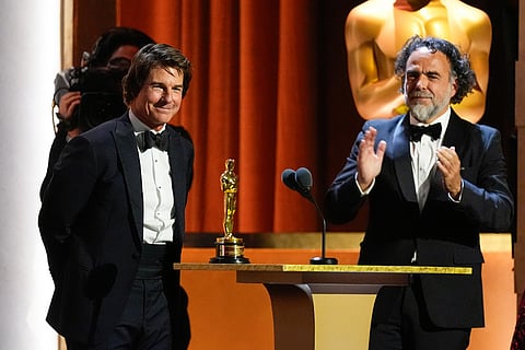 Tom Cruise, left, receives an Academy honorary award as Alejandro González Iñárritu looks on during the 16th Governors Awards at The Ray Dolby Ballroom in Los Angeles. 