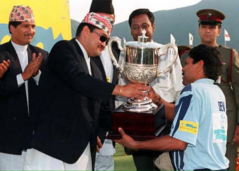 File photo of Crown Prince of Nepal, Dipendra Bir Bikram Shah, handing over the Tempo World Legends Cup to Kapil Dev.