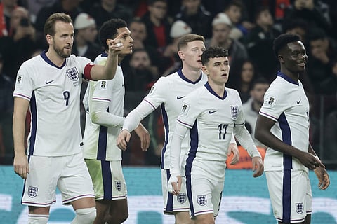 England's Harry Kane, left, celebrates with teammates after scoring his side's second goal during the World Cup 2026 group K qualifying soccer match between Albania and England, in Tirana, Albania.