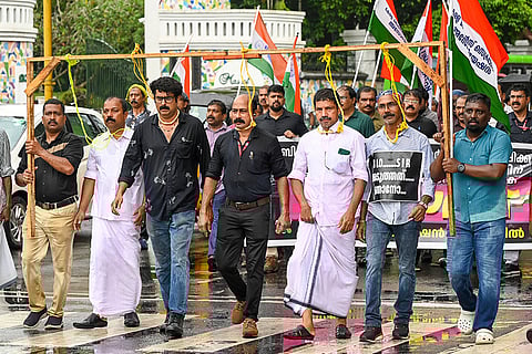 Kerala government employees under the banner of the Secretariat Action Council stage a protest outside the Election Commission office over the alleged stress-induced suicide of a Booth Level Officer involved in the Special Intensive Revision (SIR), in Thiruvananthapuram.