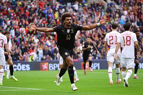 Portugal's Renato Veiga celebrates after scoring the opening goal during a World Cup 2026 group F qualifying soccer match between Portugal and Armenia in Porto, Portugal.