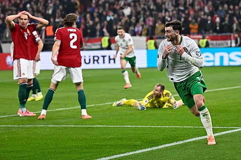 Ireland's Troy Parrott, right, celebrates after scoring his side's third goal during the World Cup 2026 group F qualifying soccer match between Hungary and Ireland in Budapest, Hungary.