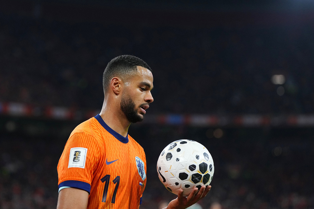 Netherlands' Cody Gakpo holds the ball during a World Cup 2026 group G qualifying soccer match between Netherlands and Lithuania in Amsterdam, Netherlands.