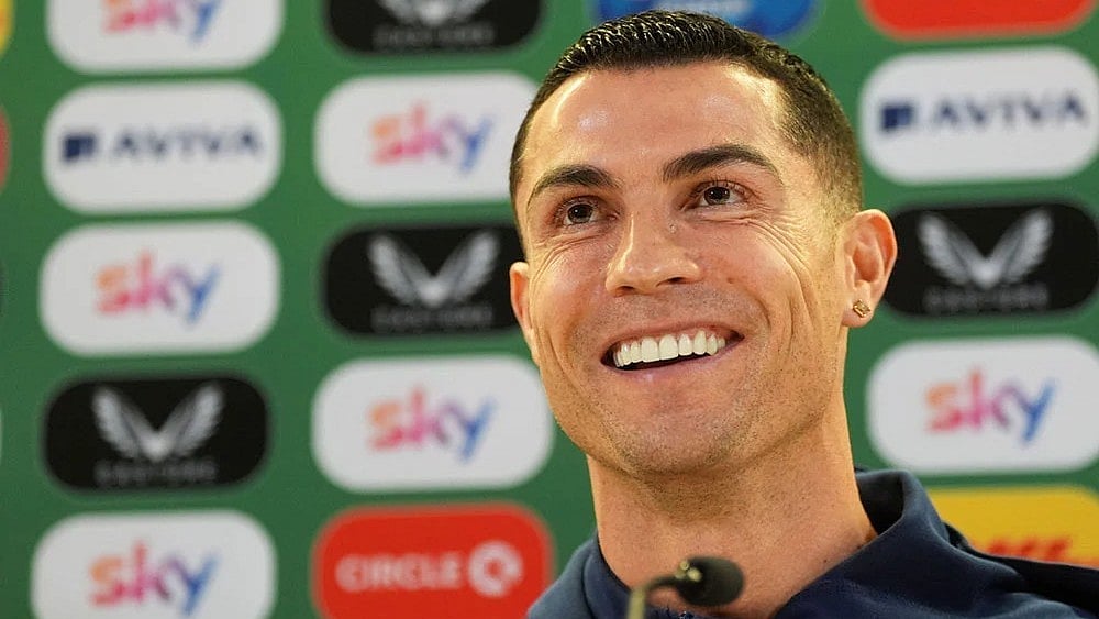 | Photo: Brian Lawless/PA via AP : Portugal's Cristiano Ronaldo speaks during a press conference in Dublin, Ireland, ahead of Thursday's World Cup qualifying soccer match against Ireland.