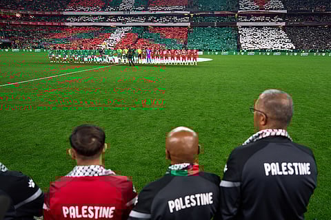 Palestinian players and Spanish players from the Basque Country line up ahead of a friendly match, held to protest Israel's military actions in Gaza, in Bilbao, Spain.