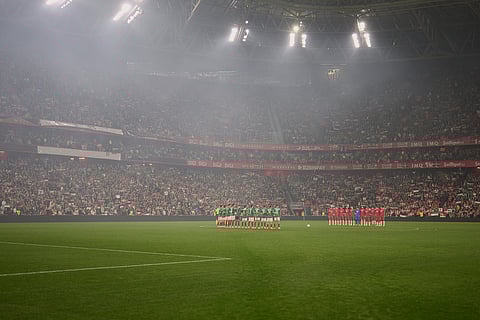Palestinian players and Spanish players from the Basque Country line up ahead of a friendly match, held to protest Israel's military actions in Gaza, in Bilbao, Spain.