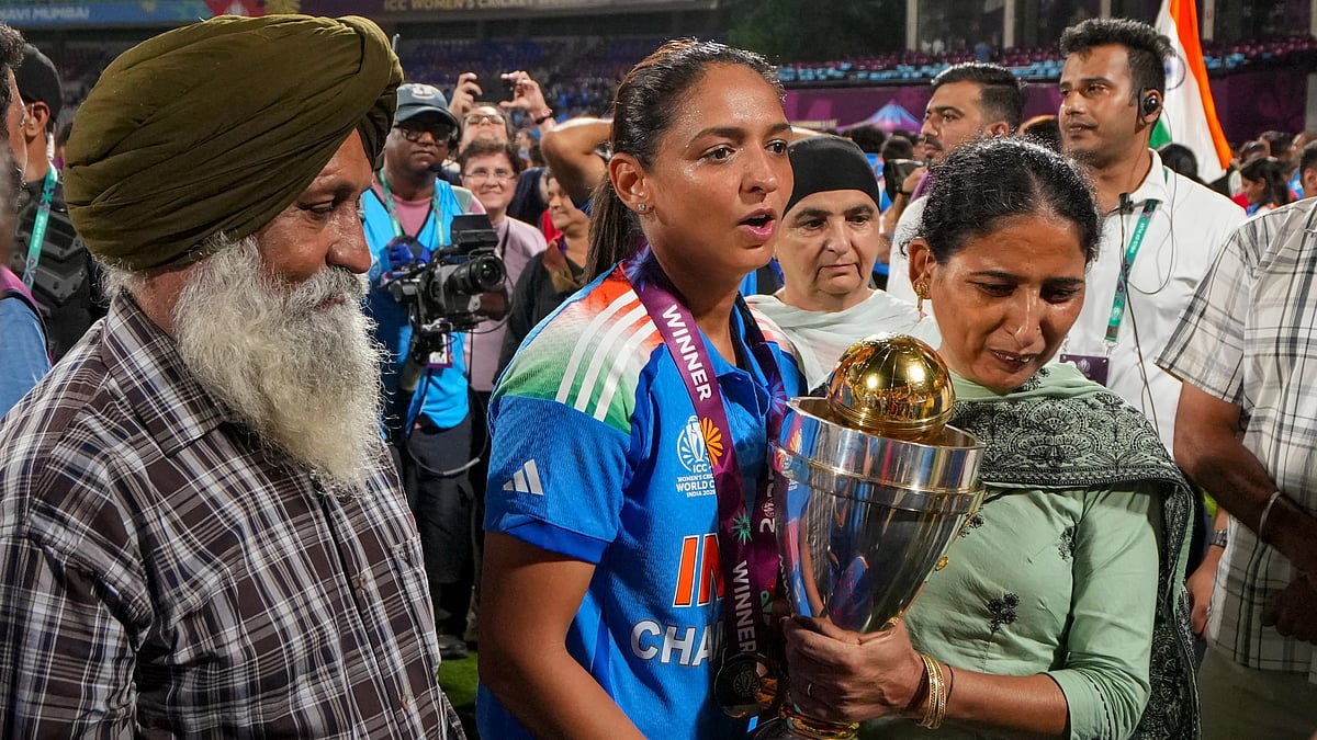 India captain Harmanpreet Kaur, centre, with her family after winning the ICC Women's World Cup 2025, at the DY Patil Stadium in Navi Mumbai. - PTI