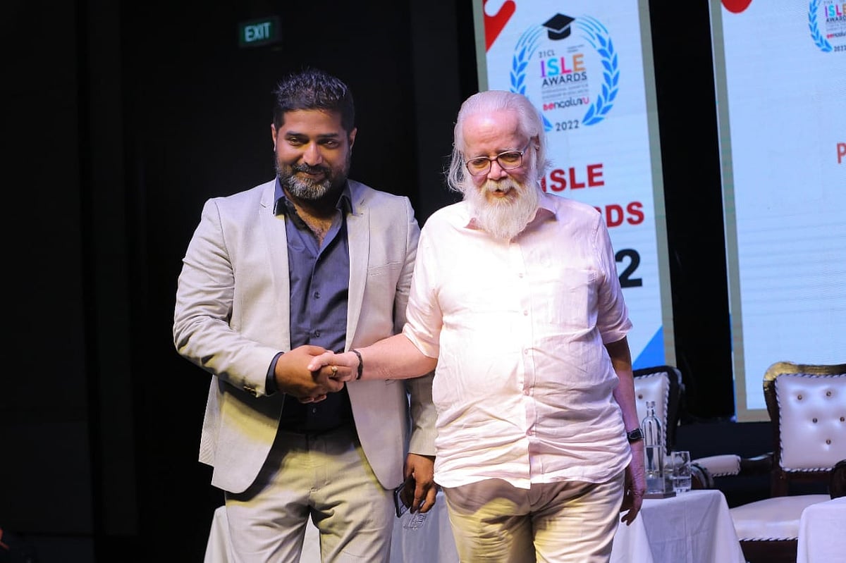 Dr. Karthik Narayanan shaking hand with other man