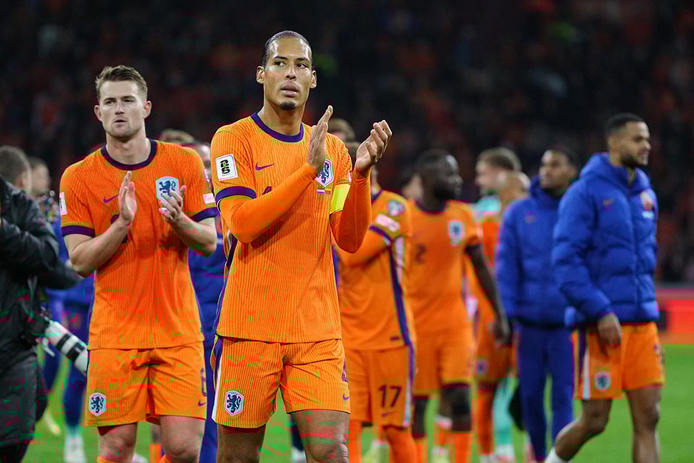 Netherlands' Virgil van Dijk, front, and teammates celebrate after a World Cup 2026 group G qualifying soccer match between Netherlands and Lithuania in Amsterdam, Netherlands. - | Photo: AP/Peter Dejong