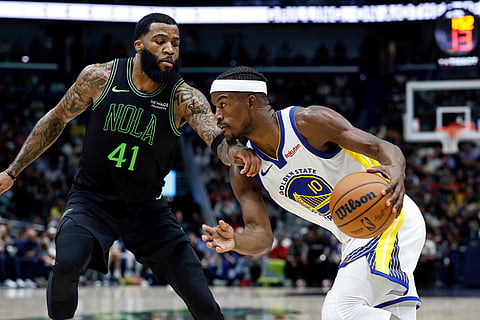 Golden State Warriors forward Jimmy Butler III (10) drives the baseline around New Orleans Pelicans guard Saddiq Bey (41) during the second quarter of an NBA basketball game in New Orleans. 