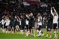 | Photo: AP/Matthias Schrader : German players celebrate qualifying for the World Cup after beating Slovakia in Leipzig, Germany.