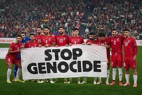 Palestinian players pose for a photo ahead of a friendly match against Spanish players from the Basque Country, held to protest Israel's military actions in Gaza, in Bilbao, Spain.