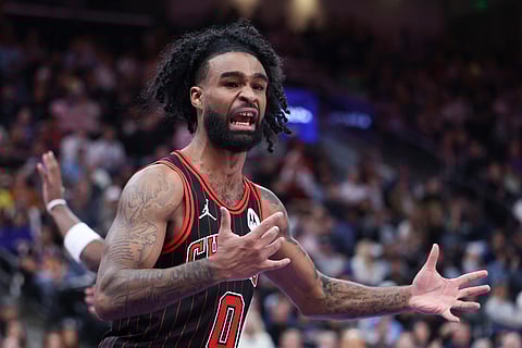 Chicago Bulls guard Coby White reacts to a call against the Utah Jazz during the second overtime of an NBA basketball game in Salt Lake City. 