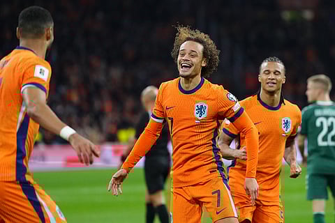 Netherlands' Xavi Simons celebrates scoring his side's 3rd goal during a World Cup 2026 group G qualifying soccer match between Netherlands and Lithuania in Amsterdam, Netherlands.