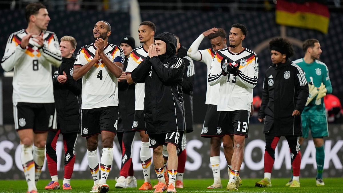 Germany players celebrate qualifying for the FIFA World Cup 2026 after beating Slovakia in Leipzig on Monday, November 17, 2025. - | Photo: AP/Matthias Schrader