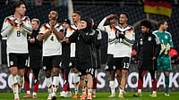 | Photo: AP/Matthias Schrader : Germany players celebrate qualifying for the FIFA World Cup 2026 after beating Slovakia in Leipzig on Monday, November 17, 2025.
