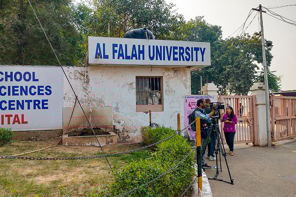Media persons outside the Al Falah School of Medical Sciences and Research Centre, in Faridabad, Haryana. The Enforcement Directorate on Tuesday launched searches against the Al Falah University of Faridabad and linked persons as part of its investigation related to the Delhi blast case. - | Photo: PTI