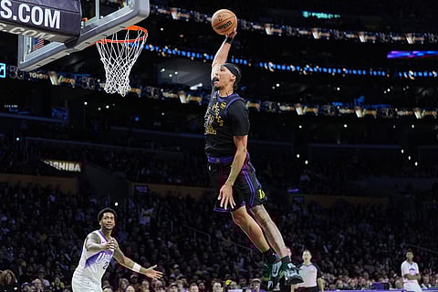 Los Angeles Lakers center Jaxson Hayes (11) goes up for a dunk during the second half of an NBA basketball game against the Utah Jazz in Los Angeles.