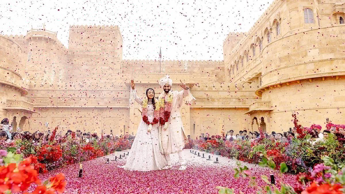 A grand outdoor wedding ceremony with a bride and groom