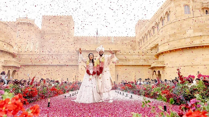 A grand outdoor wedding ceremony with a bride and groom