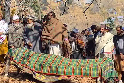 People gather around the mortal remains of Delhi blast victim Bilal Sangoo during his funeral, in Kangan, Ganderbal, Jammu and Kashmir.