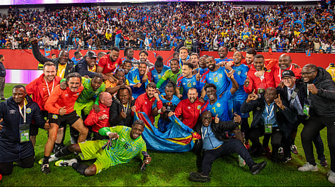 Congo national team members pose for a photo as they celebrate with their coach Sebastien Desabre after being qualified for the FIFA World Cup 2026 in the African qualifier final match against Nigeria, in Rabat, Morocco on Sunday, November 16, 2025.
