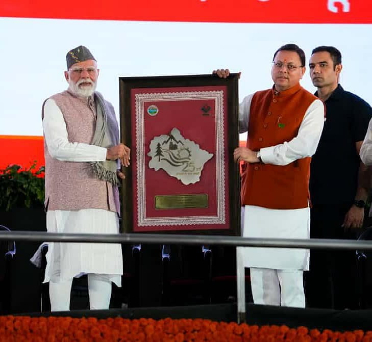 Prime Minister Narendra Modi is seen with Uttarakhand Chief Minister Pushkar Singh Dhami during the state's Silver Jubilee celebrations in Dehradun. - null