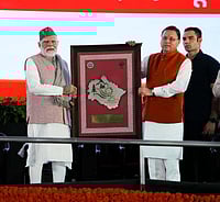 Prime Minister Narendra Modi is seen with Uttarakhand Chief Minister Pushkar Singh Dhami during the state's Silver Jubilee celebrations in Dehradun.