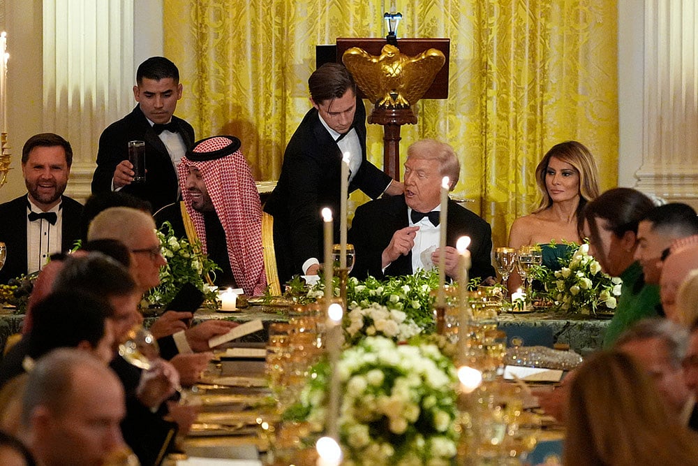 US President Donald Trump and Saudi Arabias Crown Prince Mohammed bin Salman attend a dinner with Vice President JD Vance, left, and first lady Melania Trump, right, in the East Room of the White House in Washington.