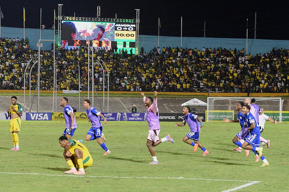 Curaçao players celebrate qualifying for the 2026 FIFA World Cup after a soccer match against Jamaica in Kingston, Jamaica. - | Photo: AP/Collin Reid