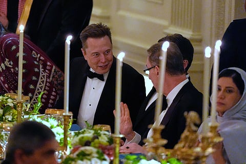 Elon Musk sits during a dinner with President Donald Trump and Saudi Arabia's Crown Prince Mohammed bin Salman in the East Room of the White House in Washington. 
