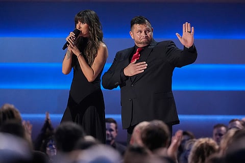 Ella Langley, left, and veteran Nick Koulchar on stage during the 59th Annual Country Music Association Awards in Nashville, Tennessee. 