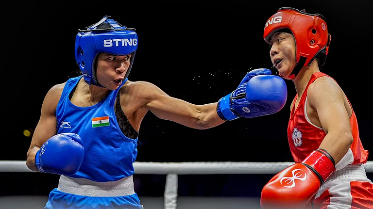 India's Nikhat Zareen, in blue, in action against Chinese Taipei's Guo Yi-Xuan during the women's 51kg final at the World Boxing Cup Finals 2025 in Greater Noida. - PTI