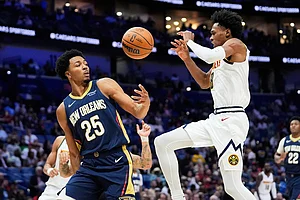 | Photo: AP/Gerald Herbert : Denver Nuggets guard Peyton Watson (8) loses the ball against New Orleans Pelicans forward Trey Murphy III (25) in the second half of an NBA basketball game in New Orleans.