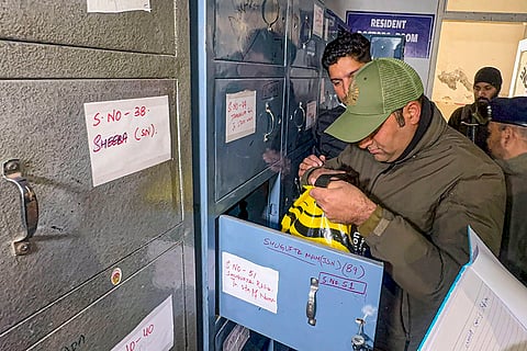 A security official during an inspection drive of lockers of the doctors and medical staff at the Government Medical College (GMC) after an AK-47 rifle was recovered earlier this month from Dr Adeel Rather's locker, in Anantnag.
