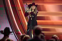 CMA Awards 2025: Lainey Wilson To Riley Green - See All The Stars At The Award Ceremony | Photo: AP/George Walker IV : Lainey Wilson receives the award for female vocalist of the year during the 59th Annual Country Music Association Awards at Bridgestone Arena in Nashville, Tennessee.