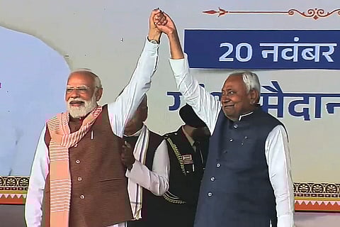 Prime Minister Narendra Modi with newly sworn-in Bihar Chief Minister Nitish Kumar during the swearing-in ceremony, at Gandhi Maidan in Patna.
