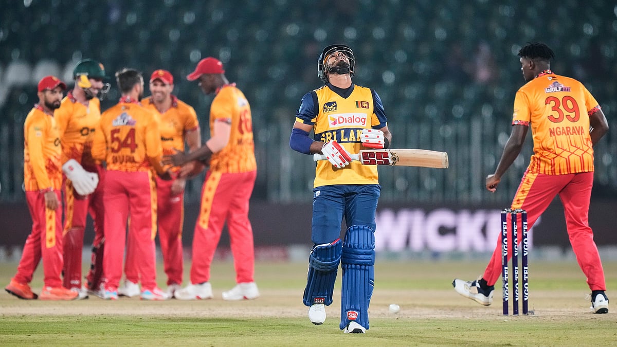 Sri Lanka's Dasun Shanaka, second right, reacts as Zimbabwe's players celebrate after his dismissal during the tri-series T20 cricket match between Sri Lanka and Zimbabwe, in Rawalpindi, Pakistan, Thursday, Nov. 20, 2025 - AP Photo/Anjum Naveed
